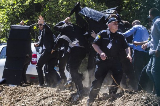 Bodyguards-use-umbrella-and-protection-to-protect-Prime-Minister-of-Serbia-Aleksandar-Vucic